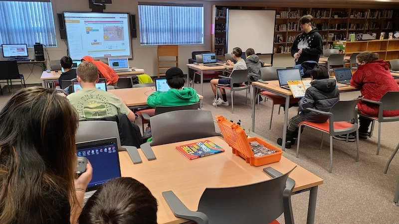 students learning robotics in a classroom